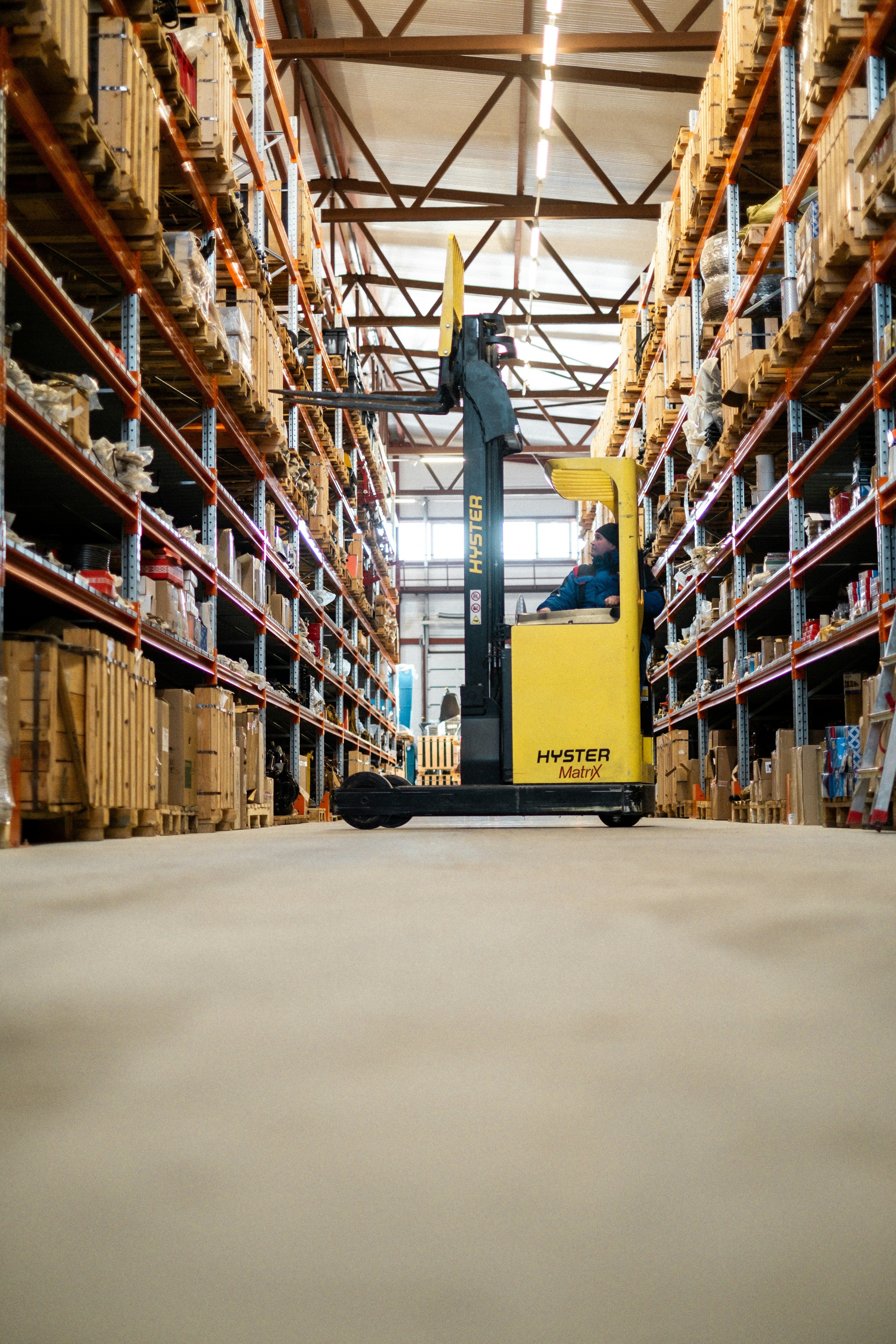 Warehouse worker checking inventory on a shelf